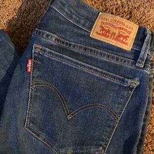 Levi’s 710 super skinny mid rise mid wash jeans